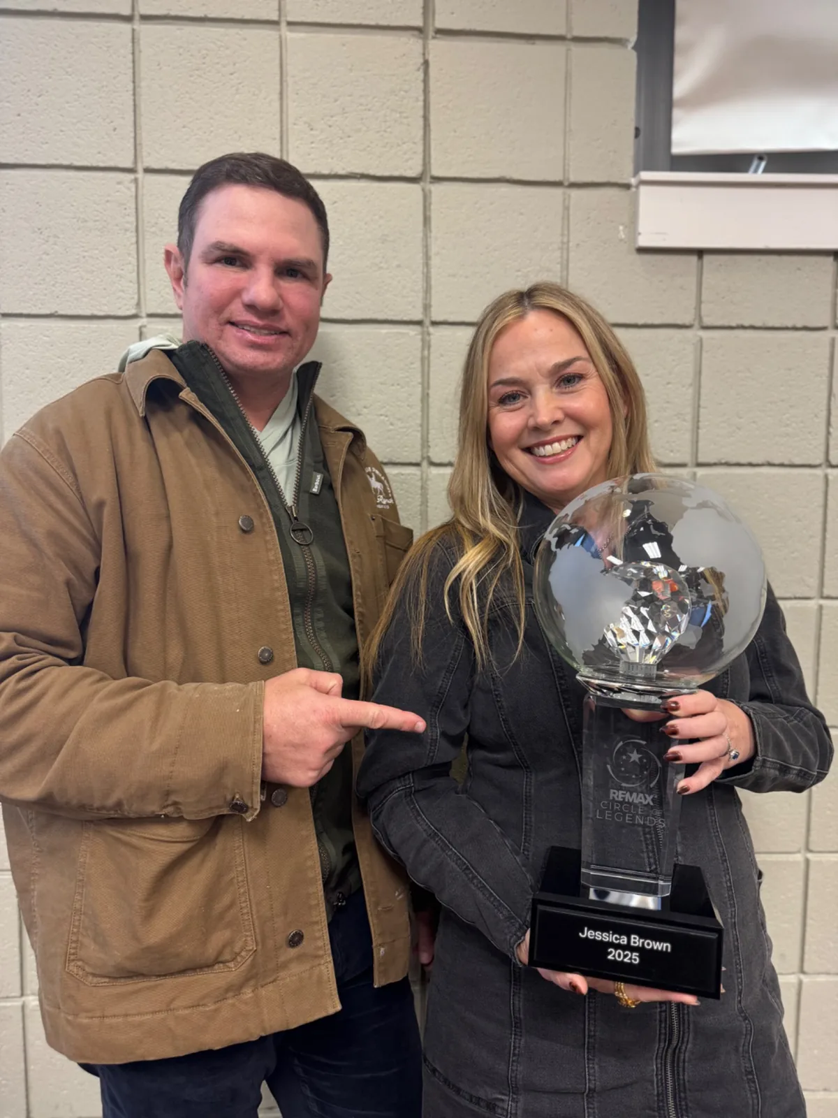 Jessica Brown with a RE/MAX award
